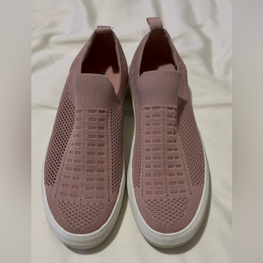 Blush pink canvas shoes.